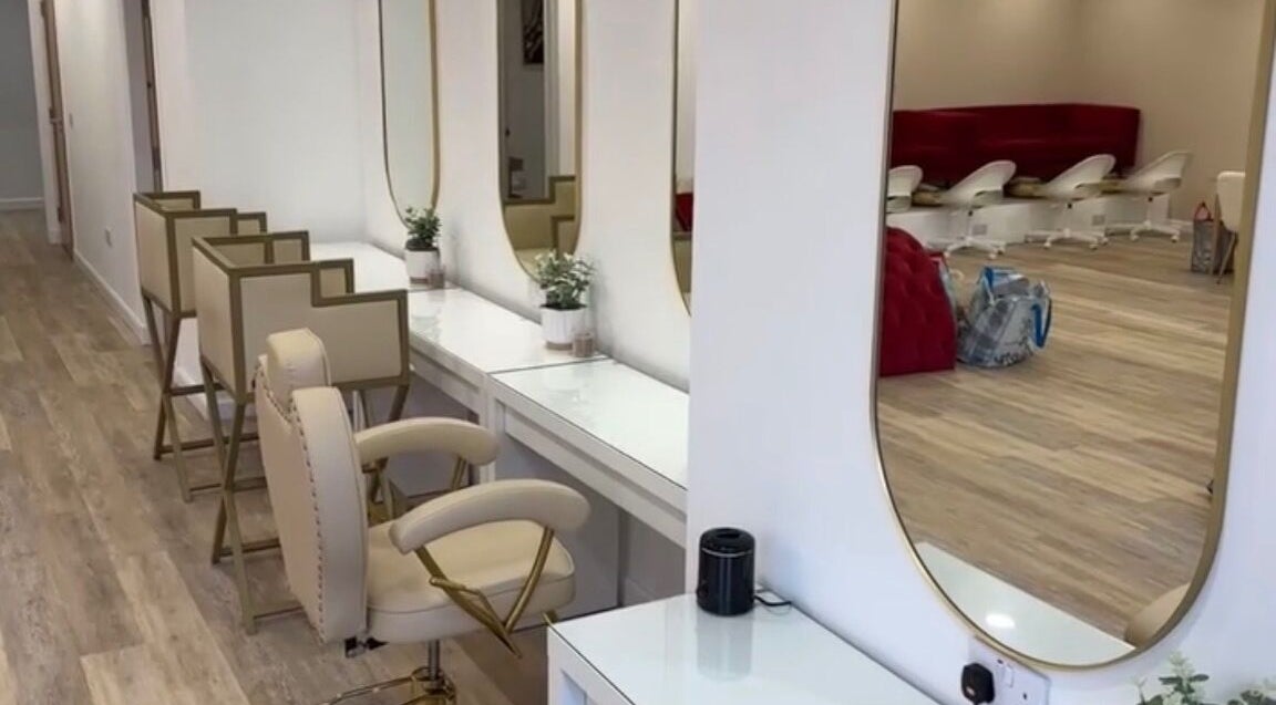 Chic, modern interior of Hair By Diaz Kidd, Inverurie, Scotland, GB with stylish seating and mirrors.