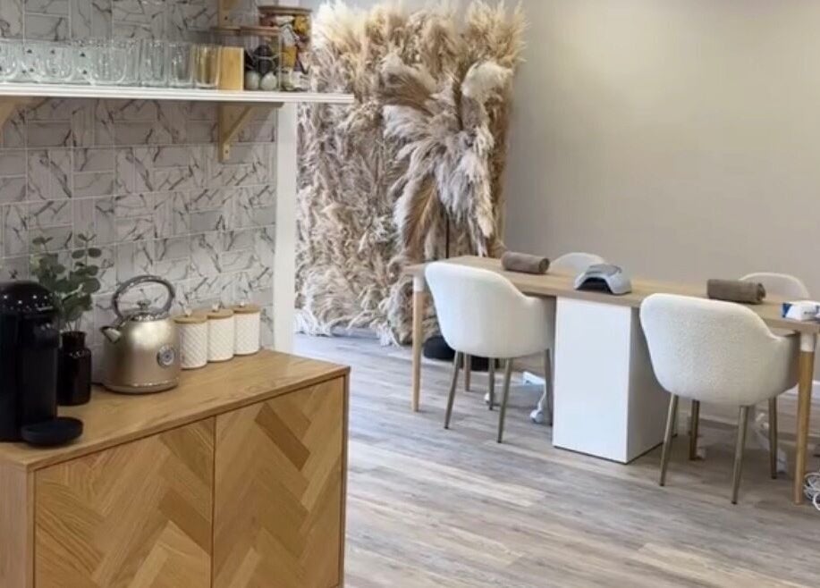 Elegant interior of Hair By Diaz Kidd, Inverurie, Scotland, with modern decor and cozy seating.