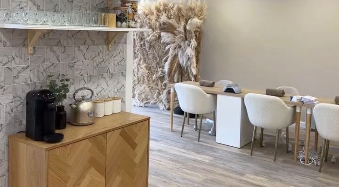 Elegant interior of Hair By Diaz Kidd, Inverurie, Scotland, with modern decor and cozy seating.