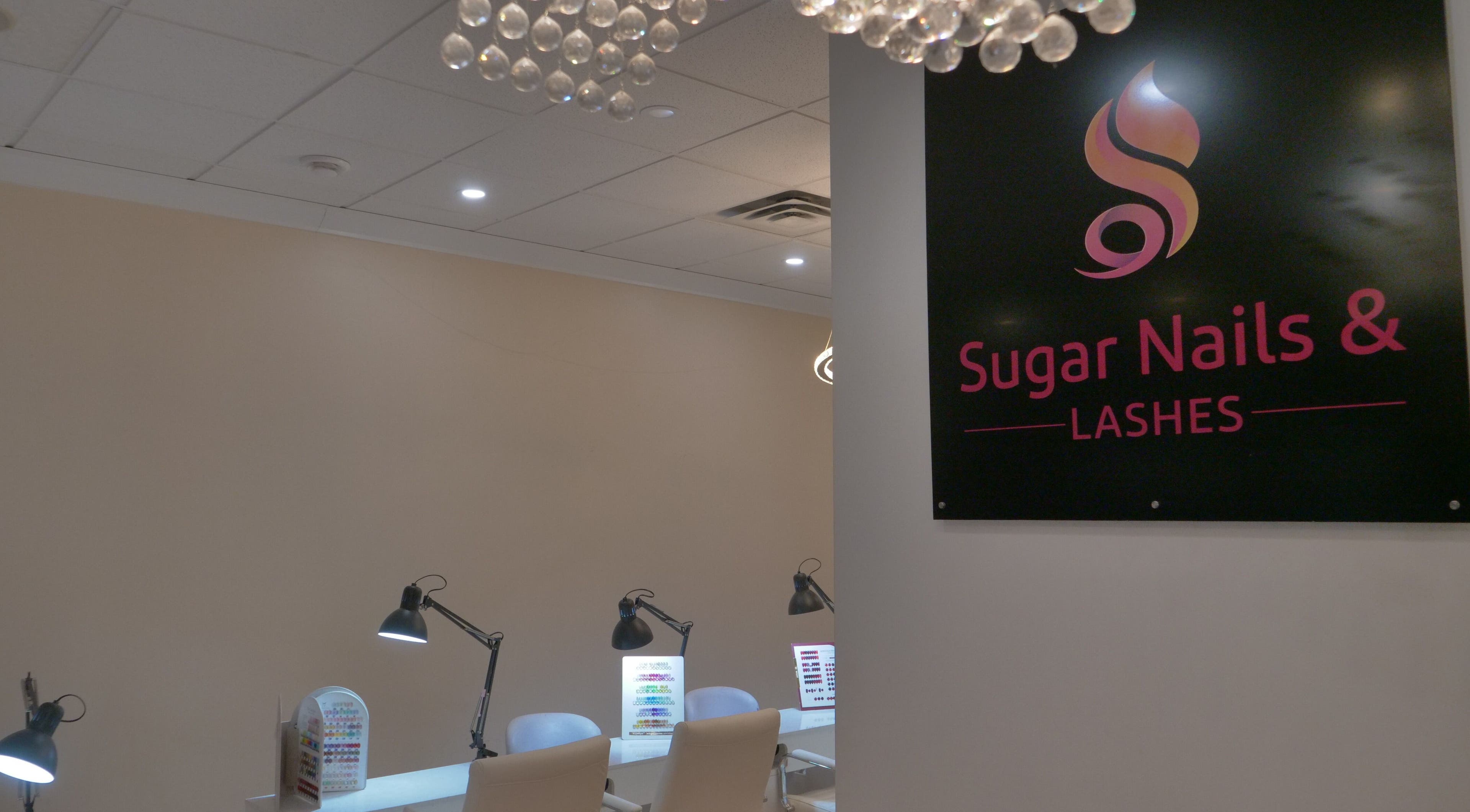 Modern interior of Sugar Nails and Lashes - Kitsilano, Vancouver, BC, CA, featuring sleek nail workstations.