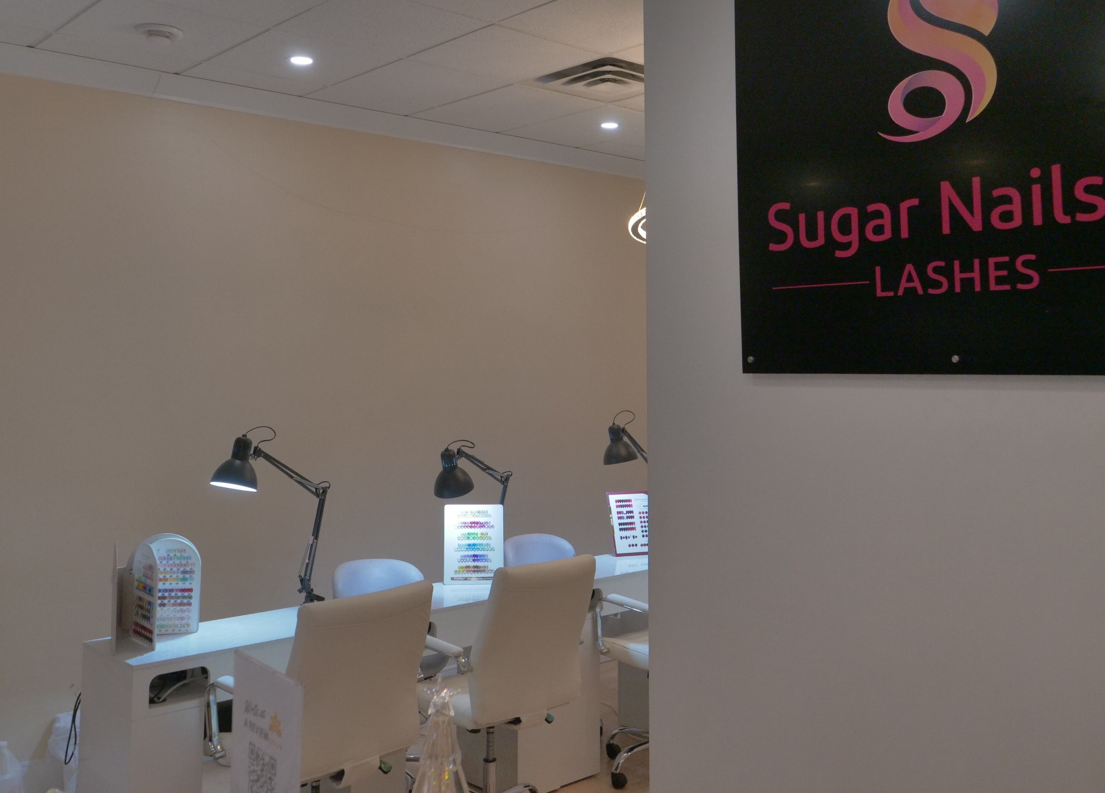 Stylish interior of Sugar Nails and Lashes - Kitsilano, Vancouver, BC, CA featuring modern nail stations.