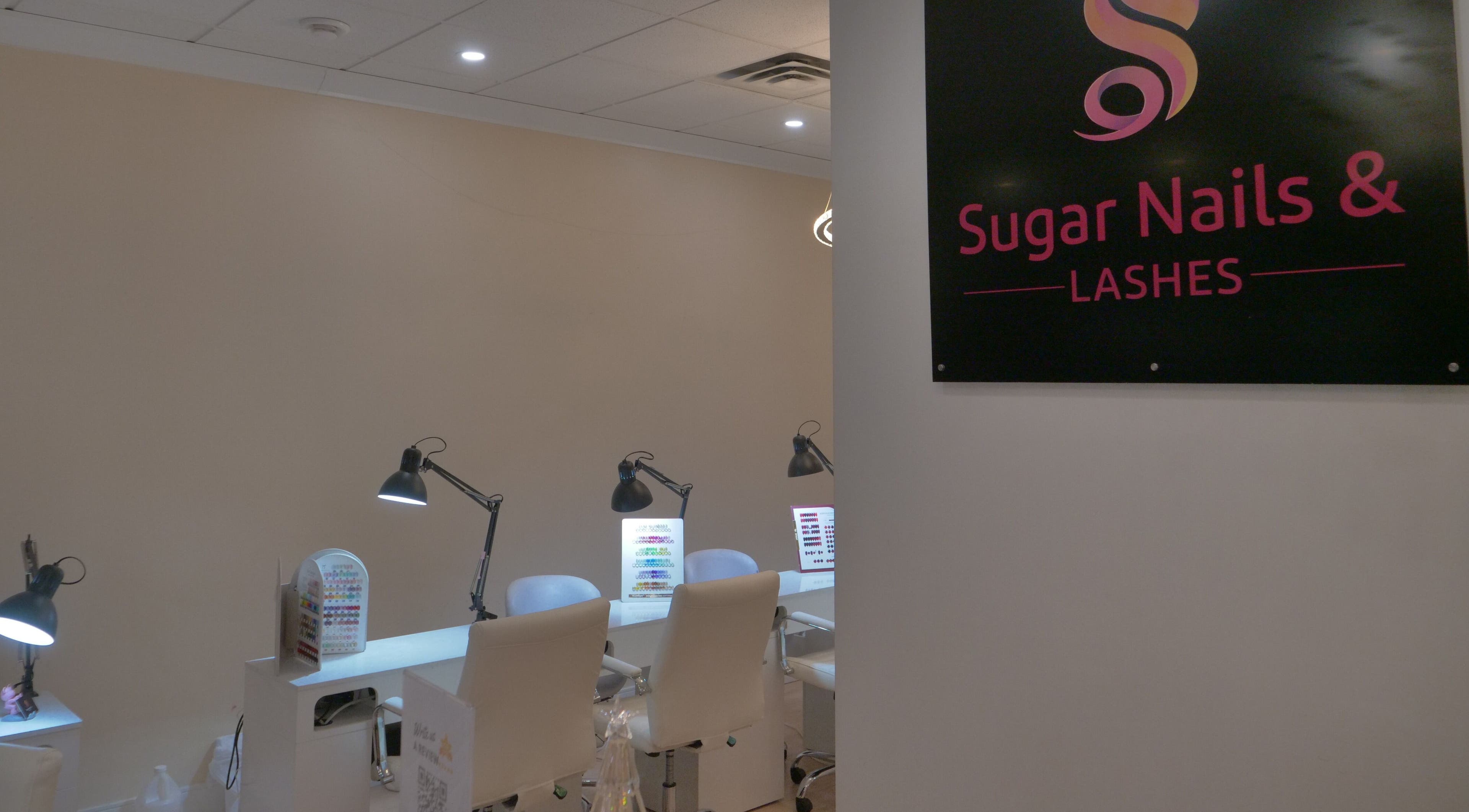 Interior view of Sugar Nails and Lashes - Kitsilano, Vancouver, BC, CA with stylish nail stations.