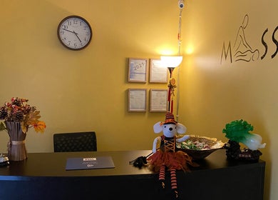 Symmetry Spa's inviting reception desk in Seattle, Washington, US with warm decor and themed accents.