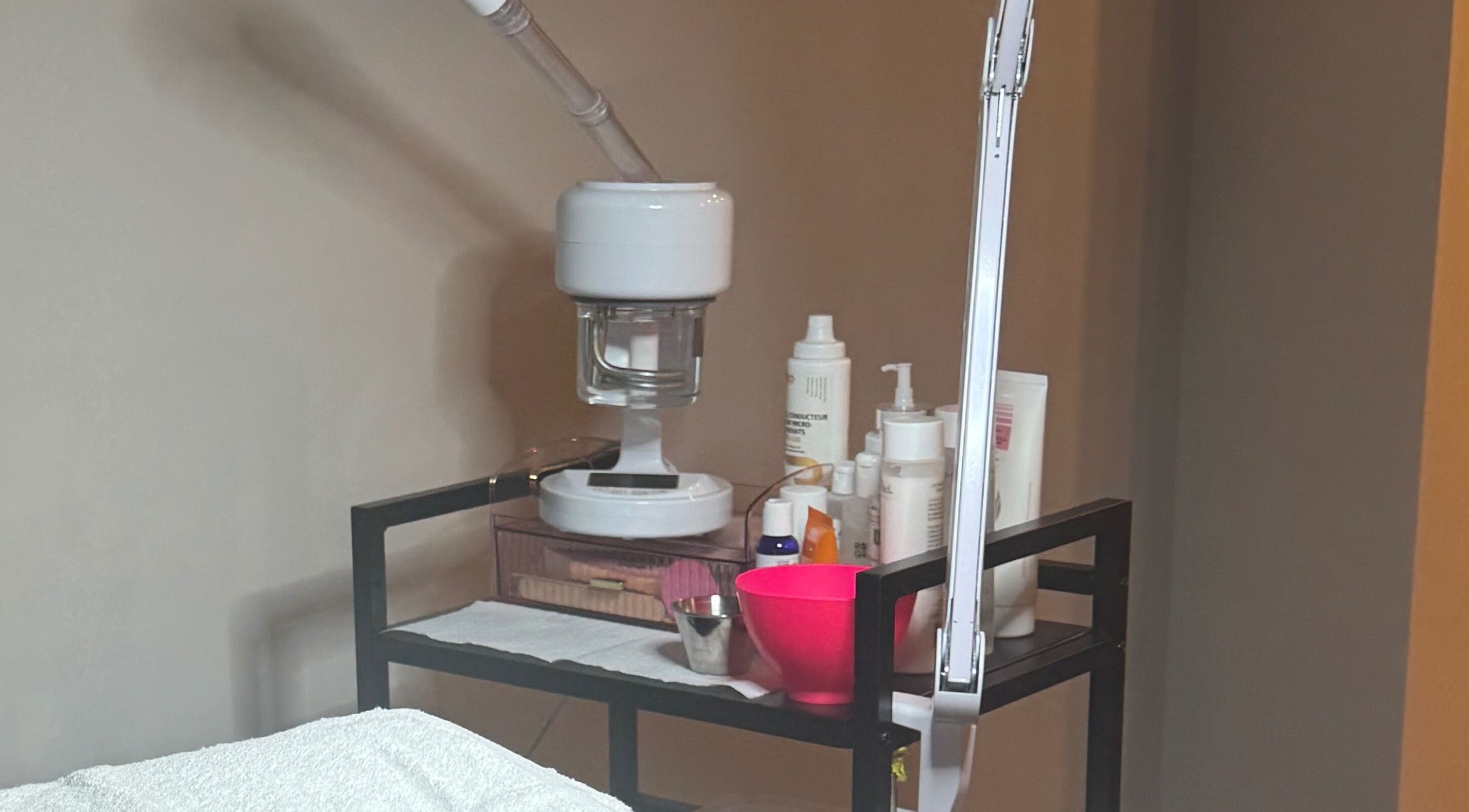 The Radiantix Spa treatment cart in Toronto, Ontario, CA, featuring skincare products and tools.