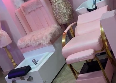 Chic pink salon chair and decor at Dollys Studio, Bradford, England, GB.