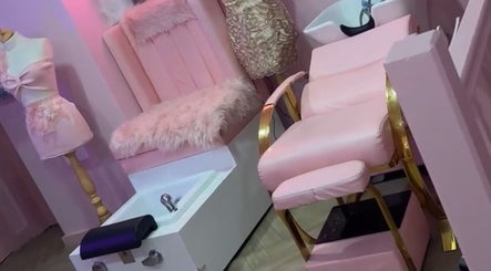 Chic pink salon chair and decor at Dollys Studio, Bradford, England, GB.