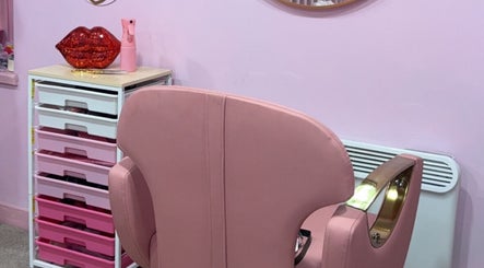 Elegant pink salon chair at Dollys Studio, Bradford, England, GB in a stylish, modern setting.