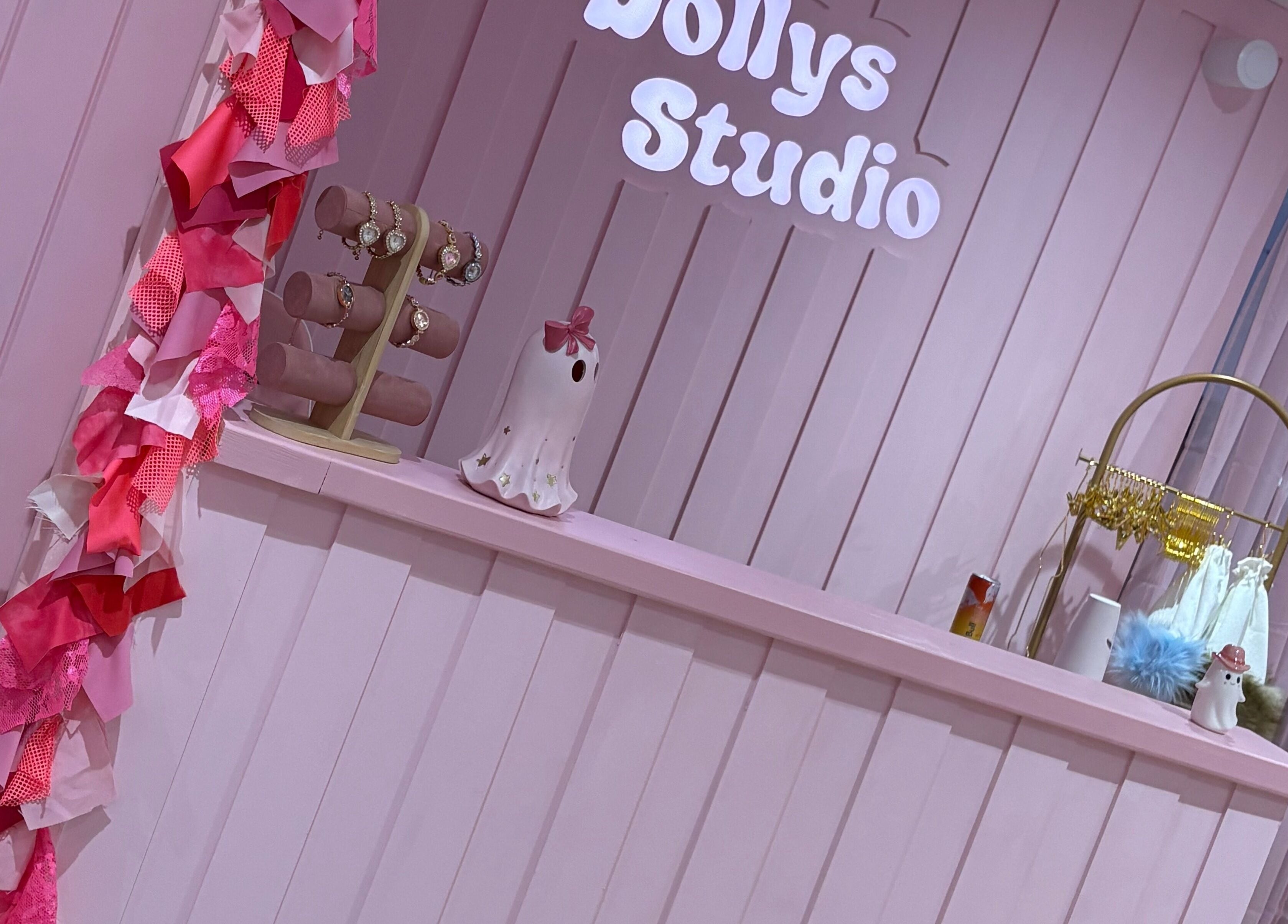Welcoming pink decor at Dollys Studio, Bradford, England, GB, showcasing elegant jewelry display.