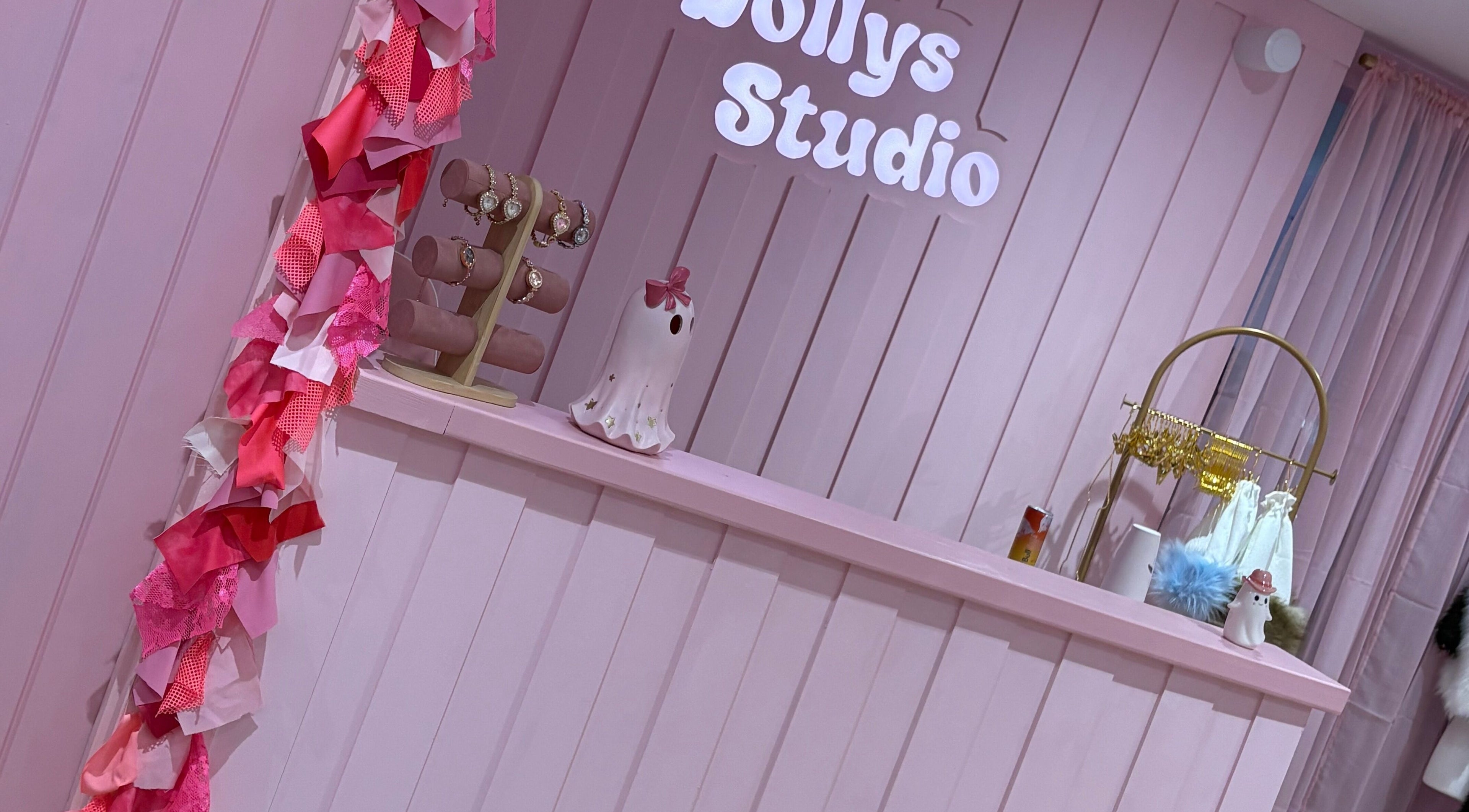 Welcoming pink decor at Dollys Studio, Bradford, England, GB, showcasing elegant jewelry display.