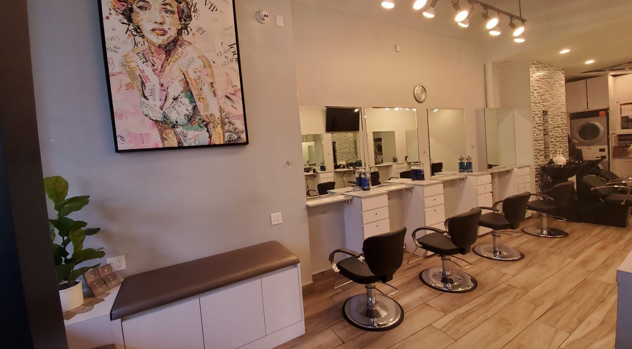 Tribeca Hair Studio NYC features modern styling chairs and chic decor in New York, New York, US.