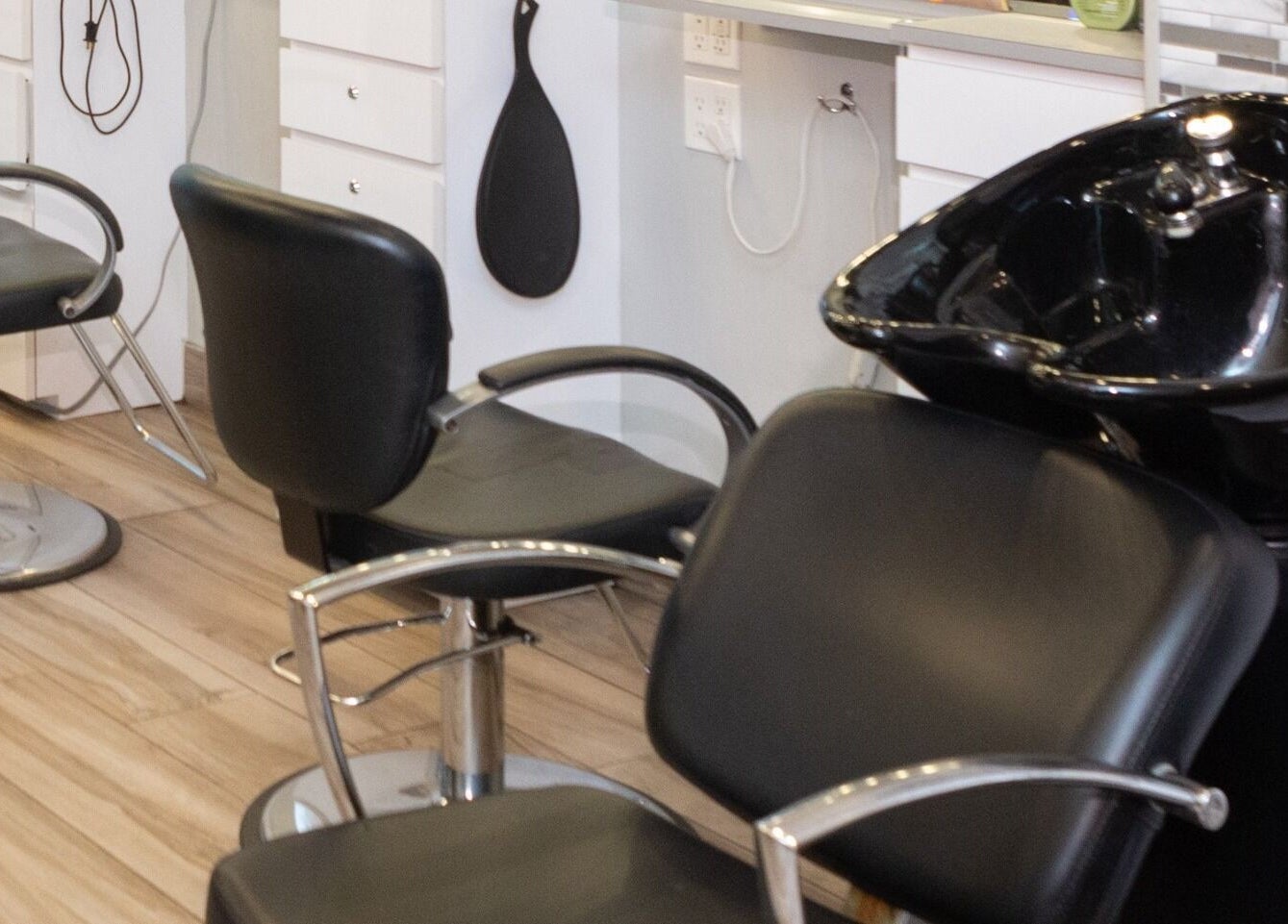 Modern salon chairs at Tribeca Hair Studio NYC, New York, New York, US, offering a luxury hair experience.