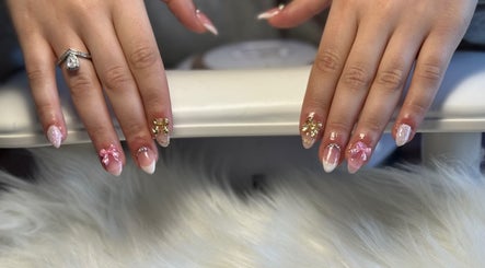 Intricate nail art at Elegance In Bloom Co. in Ellenbrook, Western Australia, AU, featuring pink and gold accents.