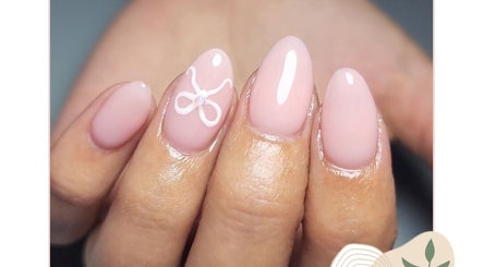 Pastel pink manicured nails with a bow design at Li-Chae Nail Studio, Pretoria, Gauteng, ZA.