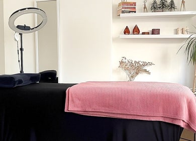 Relaxing treatment room at Lushè Beauty Studio in London, England, GB, featuring cozy decor and calm ambiance.