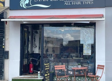 Front view of Jasmine Thai Massage with red canopy and outdoor seating, Swindon, England, GB.