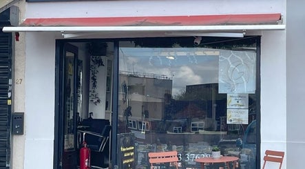 Front view of Jasmine Thai Massage with red canopy and outdoor seating, Swindon, England, GB.