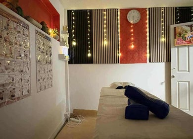Tranquil massage room at Jasmine Thai Massage in Swindon, England, GB with cozy decor and ambient lighting.