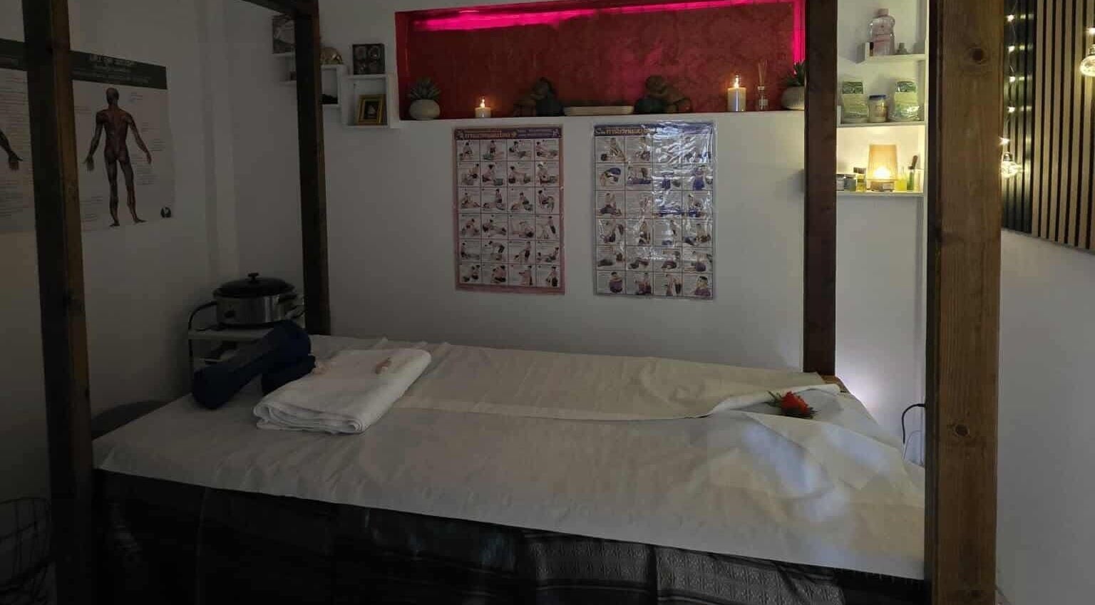 Massage room at Jasmine Thai Massage in Swindon, England, GB with candles and calming decor.