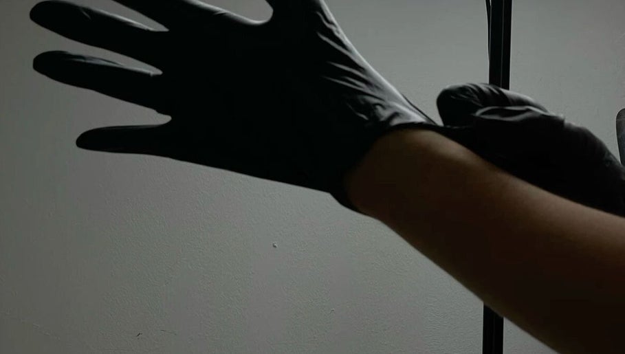Professional in gloves at KuratedbyKirsty, Roodepoort, Gauteng, ZA, ensuring high hygiene standards.