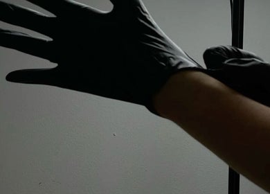 Professional in gloves at KuratedbyKirsty, Roodepoort, Gauteng, ZA, ensuring high hygiene standards.
