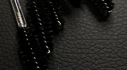 Close-up of mascara brushes on a textured surface at KuratedbyKirsty, Roodepoort, Gauteng, ZA.