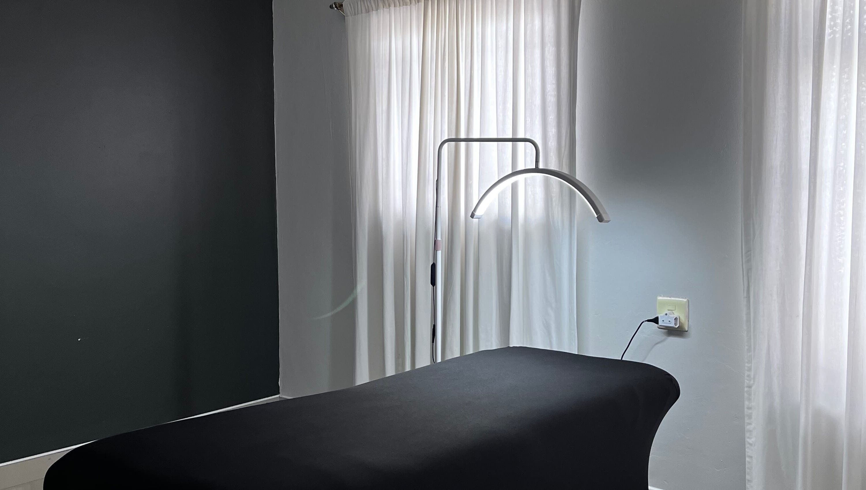 Relax in the serene treatment room at Kurated by Kirsty, Gqeberha, Eastern Cape, ZA with soft natural lighting.