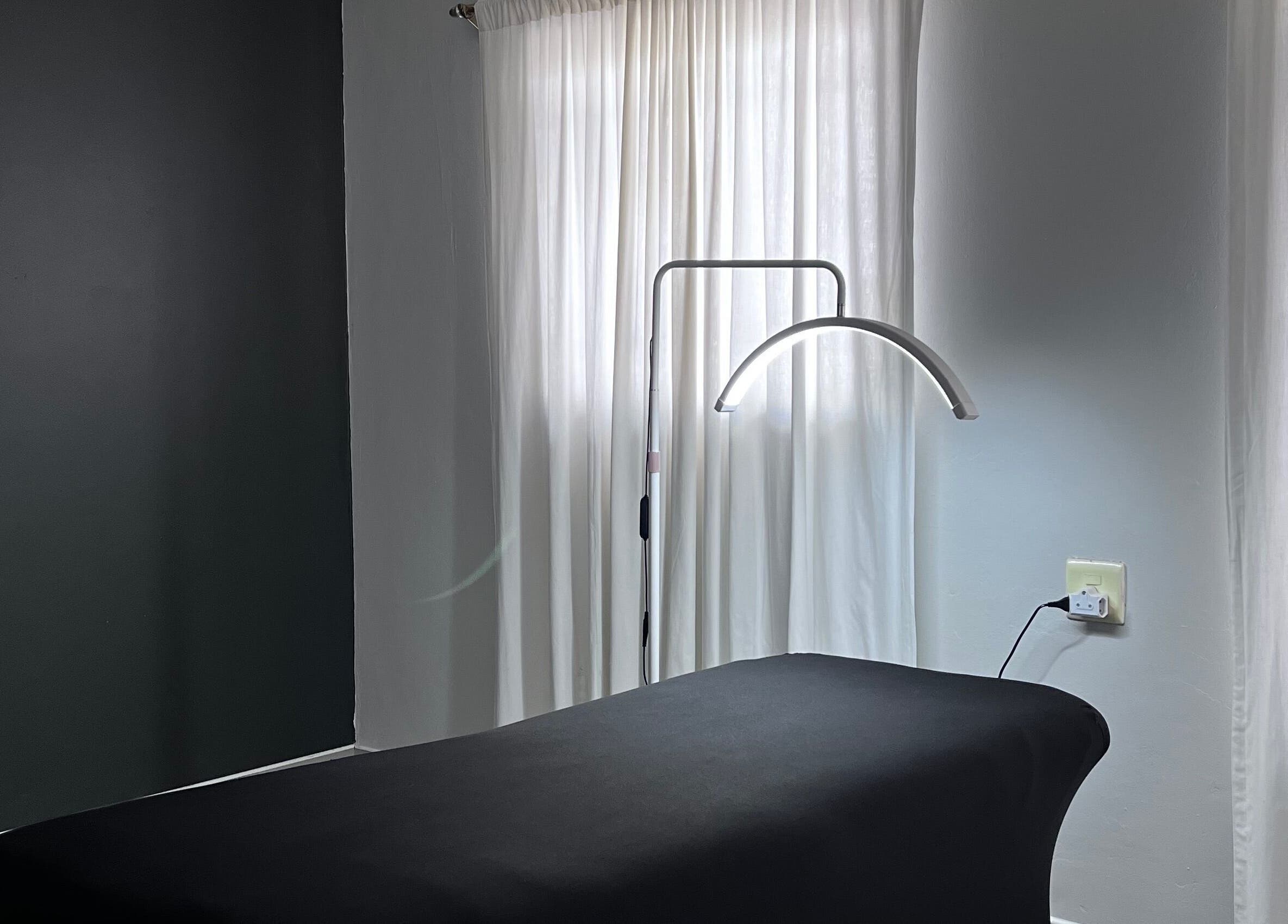 Relax in the serene treatment room at Kurated by Kirsty, Gqeberha, Eastern Cape, ZA with soft natural lighting.
