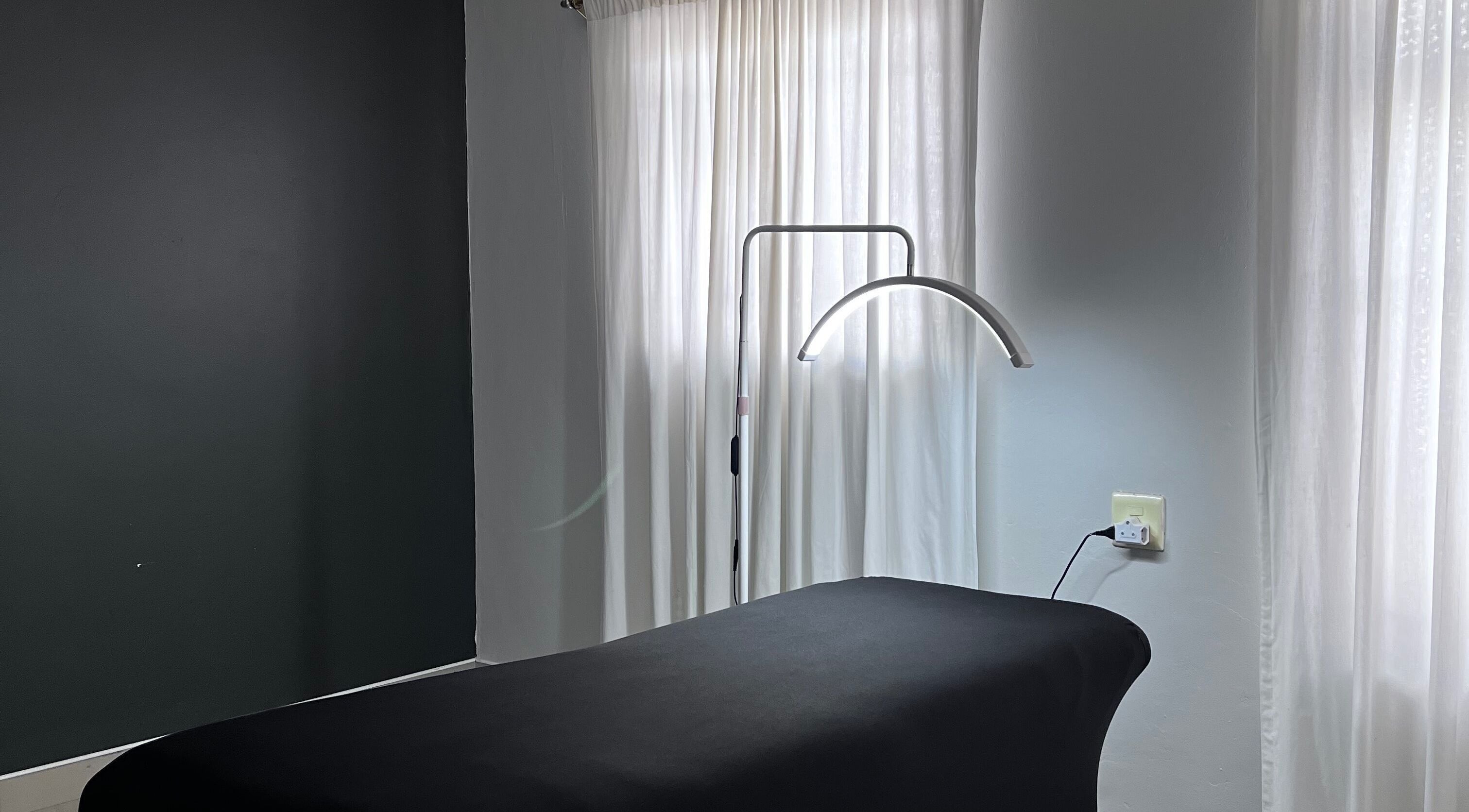 Relax in the serene treatment room at Kurated by Kirsty, Gqeberha, Eastern Cape, ZA with soft natural lighting.
