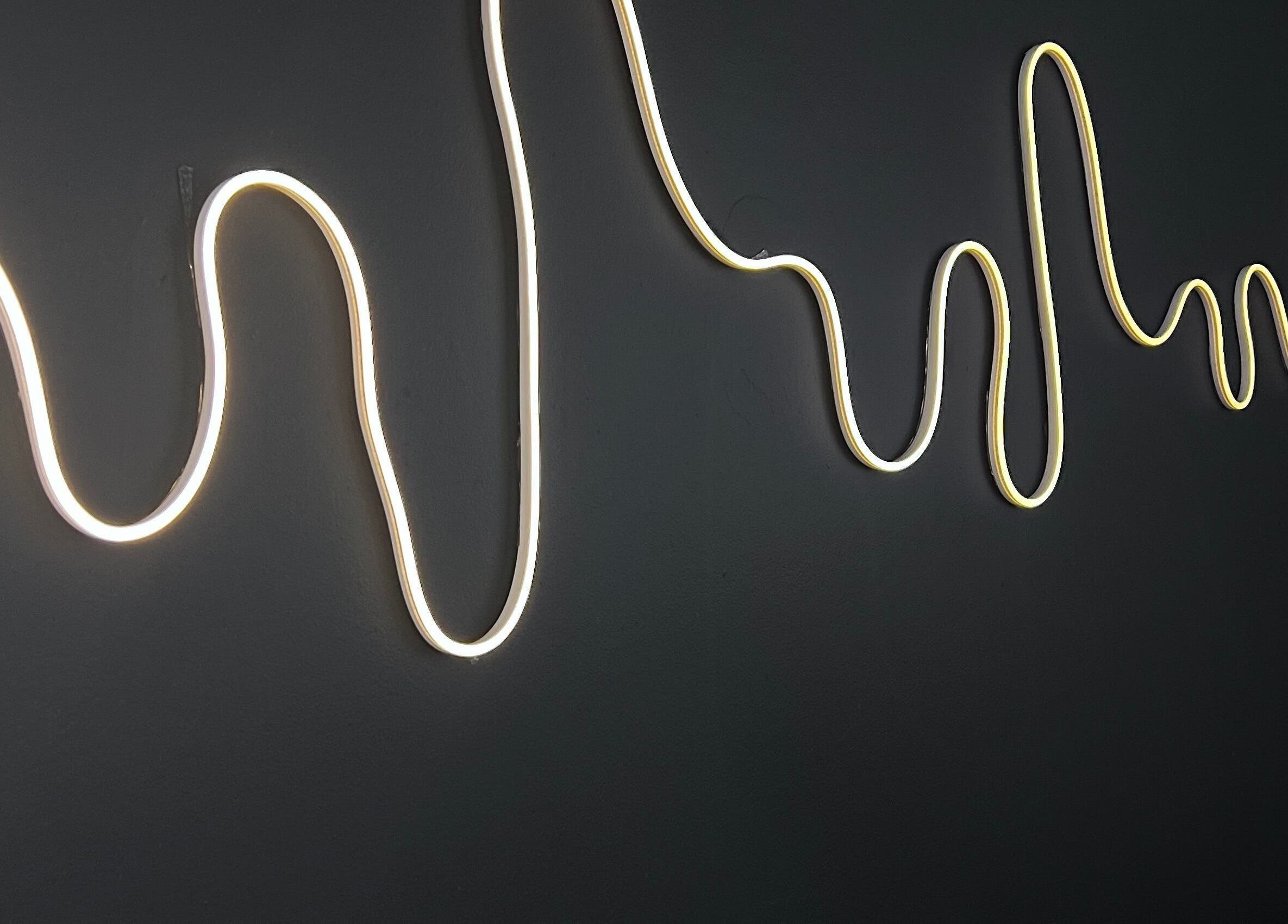 Stylish neon wave light decor at Kurated by Kirsty in Gqeberha, Eastern Cape, ZA.