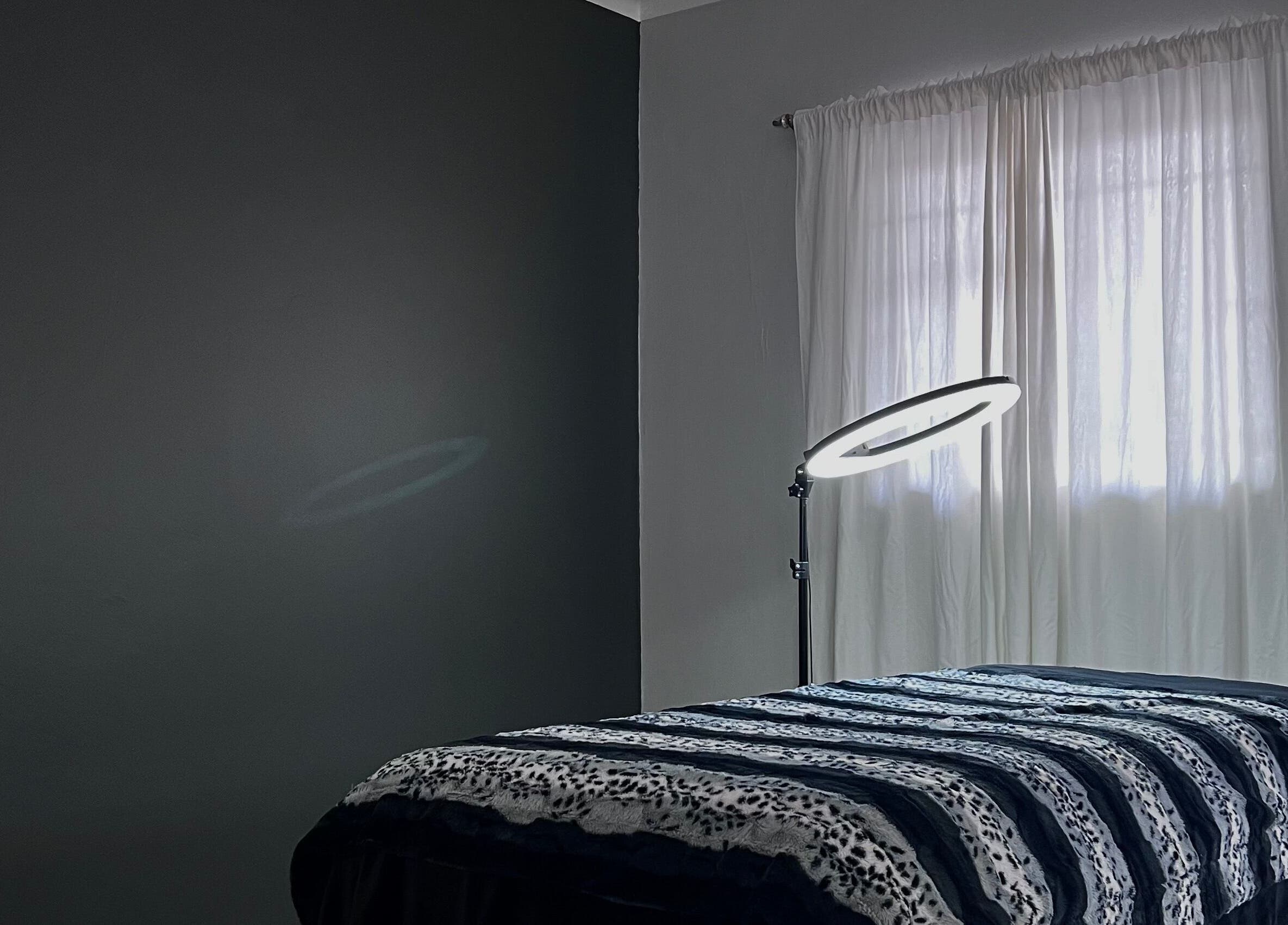 Calm treatment room at Kurated by Kirsty, Gqeberha, Eastern Cape, ZA, featuring a cozy bed and soft lighting.