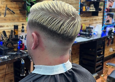 Stylish taper fade haircut at Himan mobile barber, Lichfield, England, GB. Modern barbershop interior.