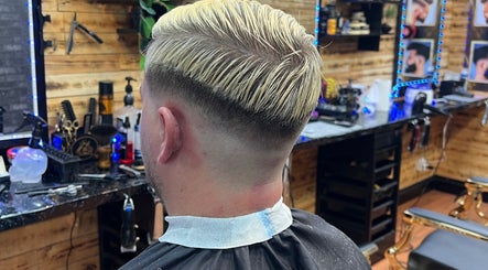Stylish taper fade haircut at Himan mobile barber, Lichfield, England, GB. Modern barbershop interior.