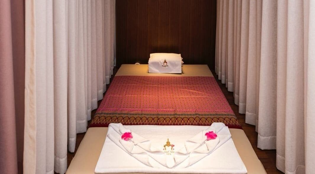 Relaxing massage bed setup at Royal Siam Spa in Abu Dhabi, AE, featuring elegant decor and soothing ambiance.