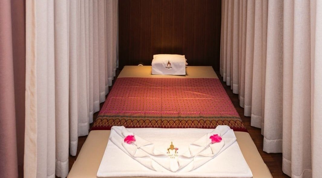 Elegant massage bed setup at Royal Siam Spa in Abu Dhabi, AE, featuring plush linens and serene ambiance.