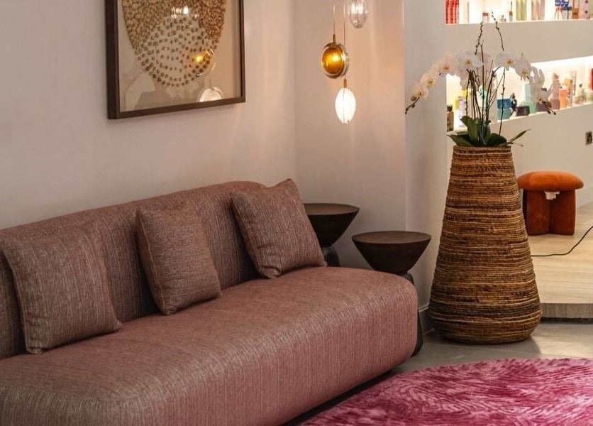 Elegant lounge at Royal Siam Spa Abu Dhabi, AE featuring soft seating, warm lighting, and chic decor.