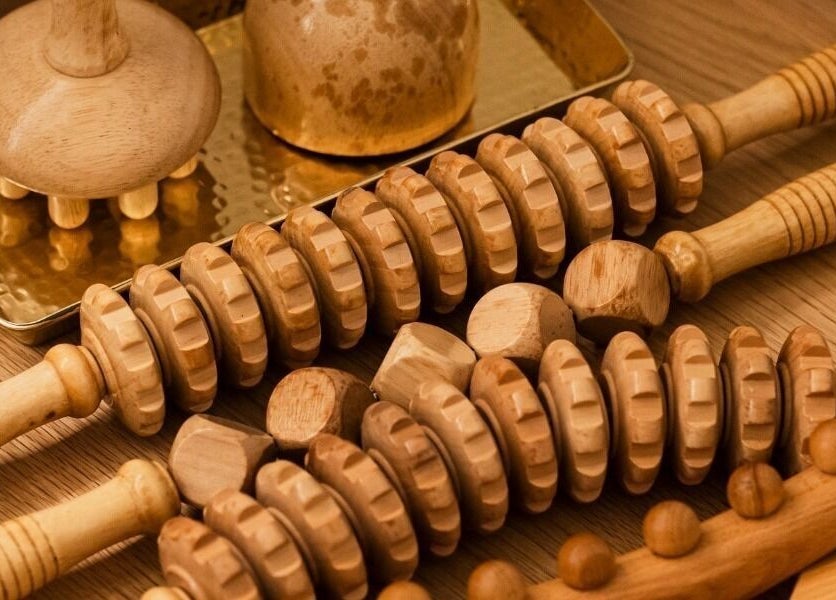 Wooden massage tools at Royal Siam Spa, Abu Dhabi, AE, showcasing traditional relaxation techniques.