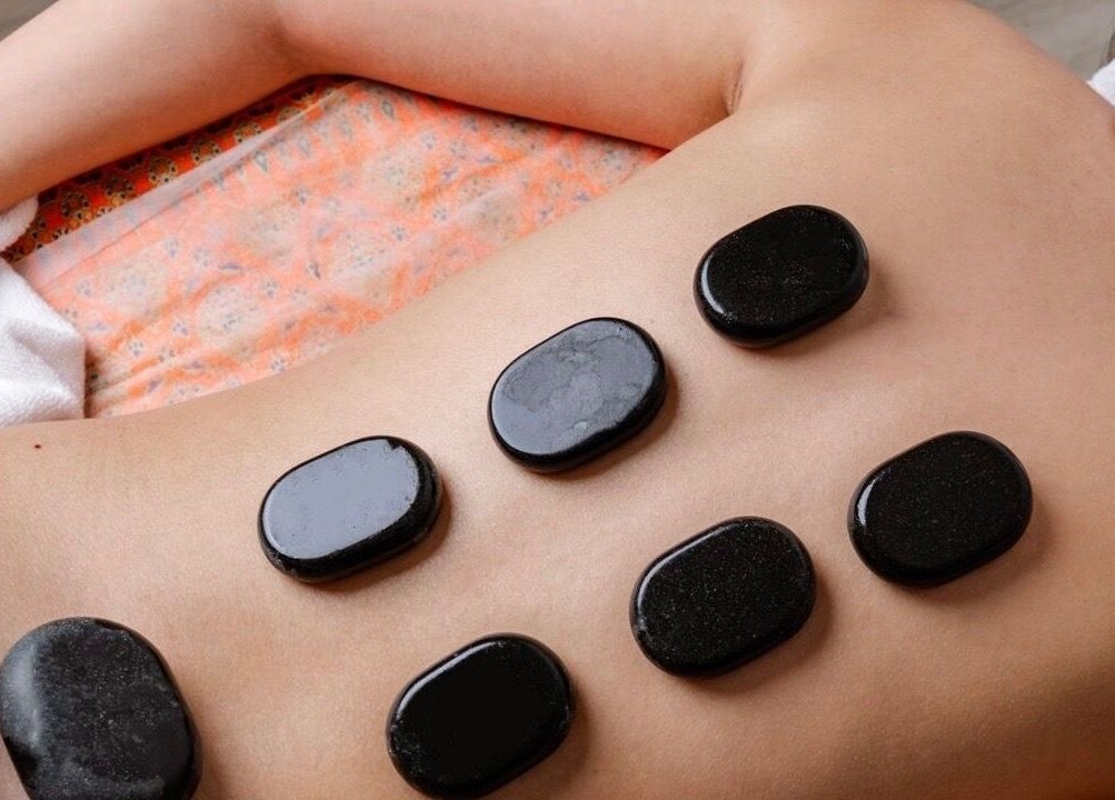 Relaxing hot stone massage at Royal Siam Spa, Abu Dhabi, AE for ultimate wellness and tranquility.