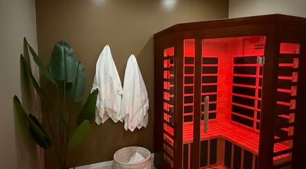 Cozy sauna at Golden Sweat, London, Ontario, CA, offering a relaxing and rejuvenating experience with warm infrared light.