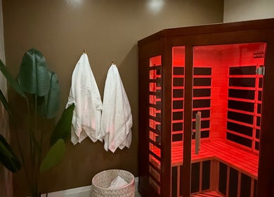 Cozy sauna at Golden Sweat, London, Ontario, CA, with soft lighting and plush towels.