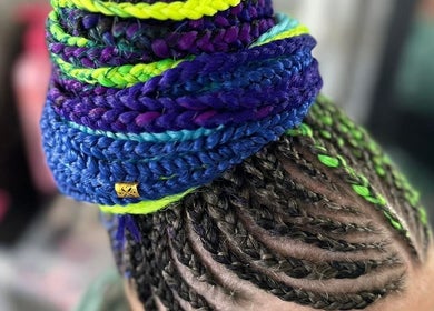 Colorful braided hairstyle at EMbraid Studio, Christchurch, Canterbury Region, NZ, showcasing intricate hair art.