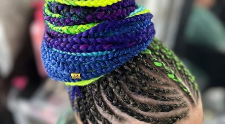 Colorful braided hairstyle at EMbraid Studio, Christchurch, Canterbury Region, NZ, showcasing intricate hair art.