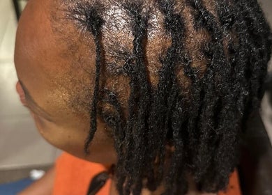 Styled locs at EMbraid Studio in Christchurch, Canterbury Region, NZ, showcasing expert braiding craftsmanship.