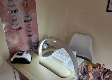 Elegant nail station at Satori Nails, Peterborough, England, GB with tools and nail color samples on display.