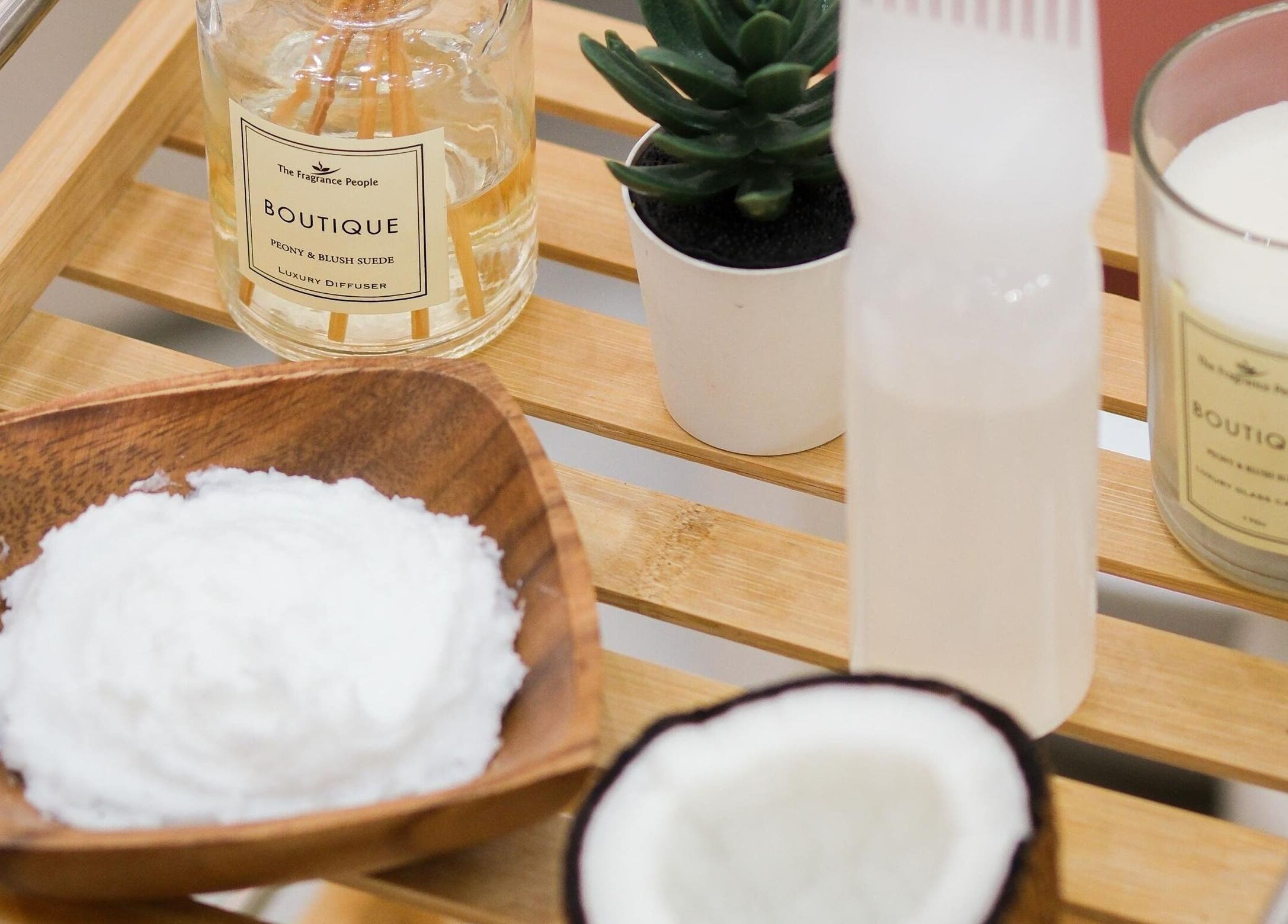 Luxury beauty essentials at LuluGlam Lounge, Dubai, Dubai, AE, showcasing candles and creamy textures.