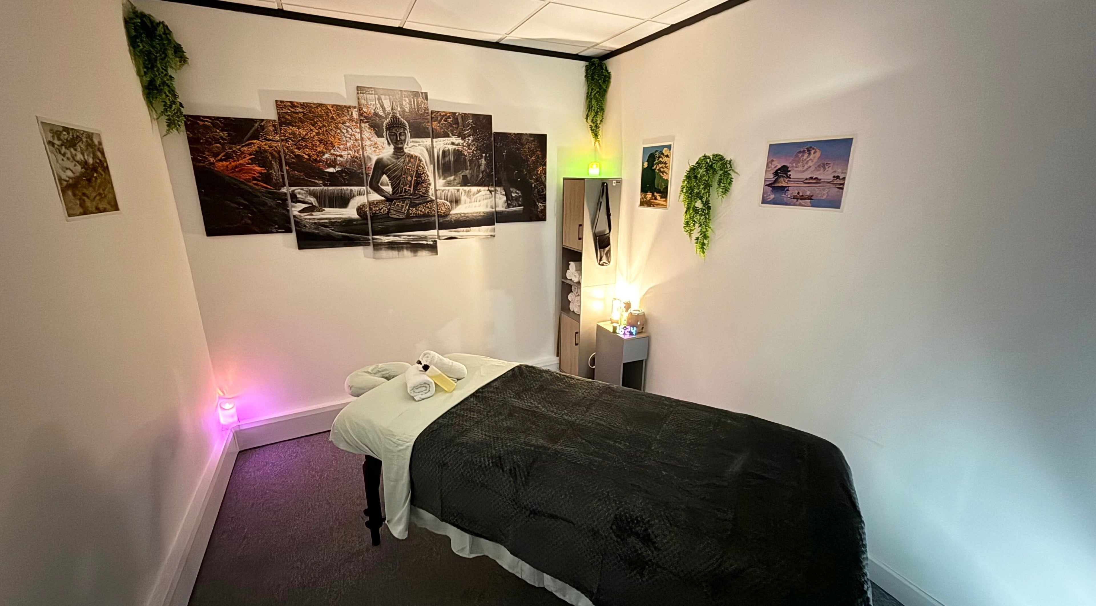 Peaceful massage room at The Stress Compress, Manchester, England, GB with serene decor and relaxing ambiance.