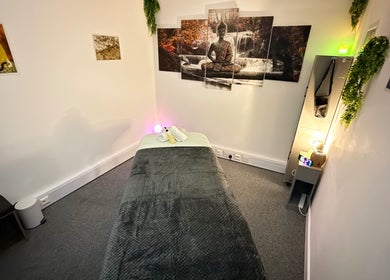Relaxing massage room at The Stress Compress, Manchester, England, GB with calming decor and soft lighting.