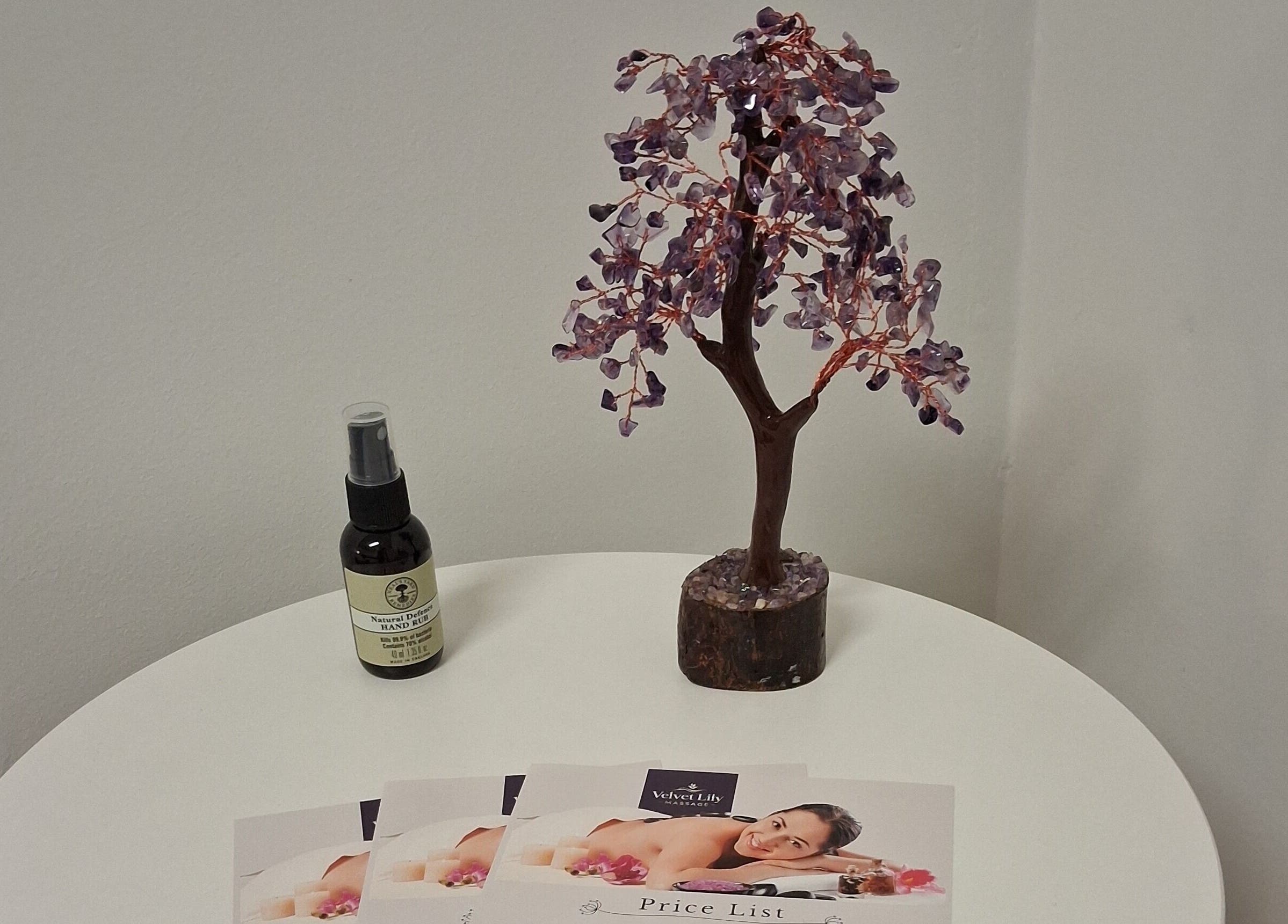 Velvet Lily Massage decor features a lilac gemstone tree and products on display in Dunfermline, Scotland, GB.