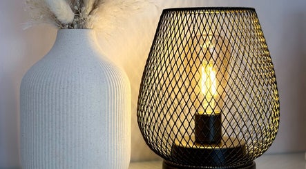 Warm lighting and chic decor at Nicola Meir Holistic Therapies, Sidcup, GB create a calming environment.