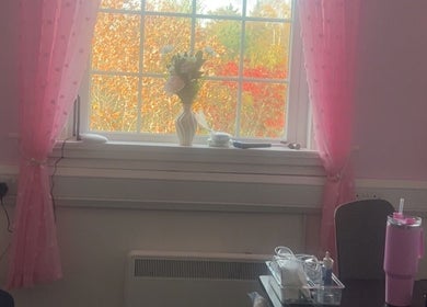 Charming pink room with a vase and tools at Luna Glow, Edinburgh, Scotland, GB, providing a serene beauty ambiance.
