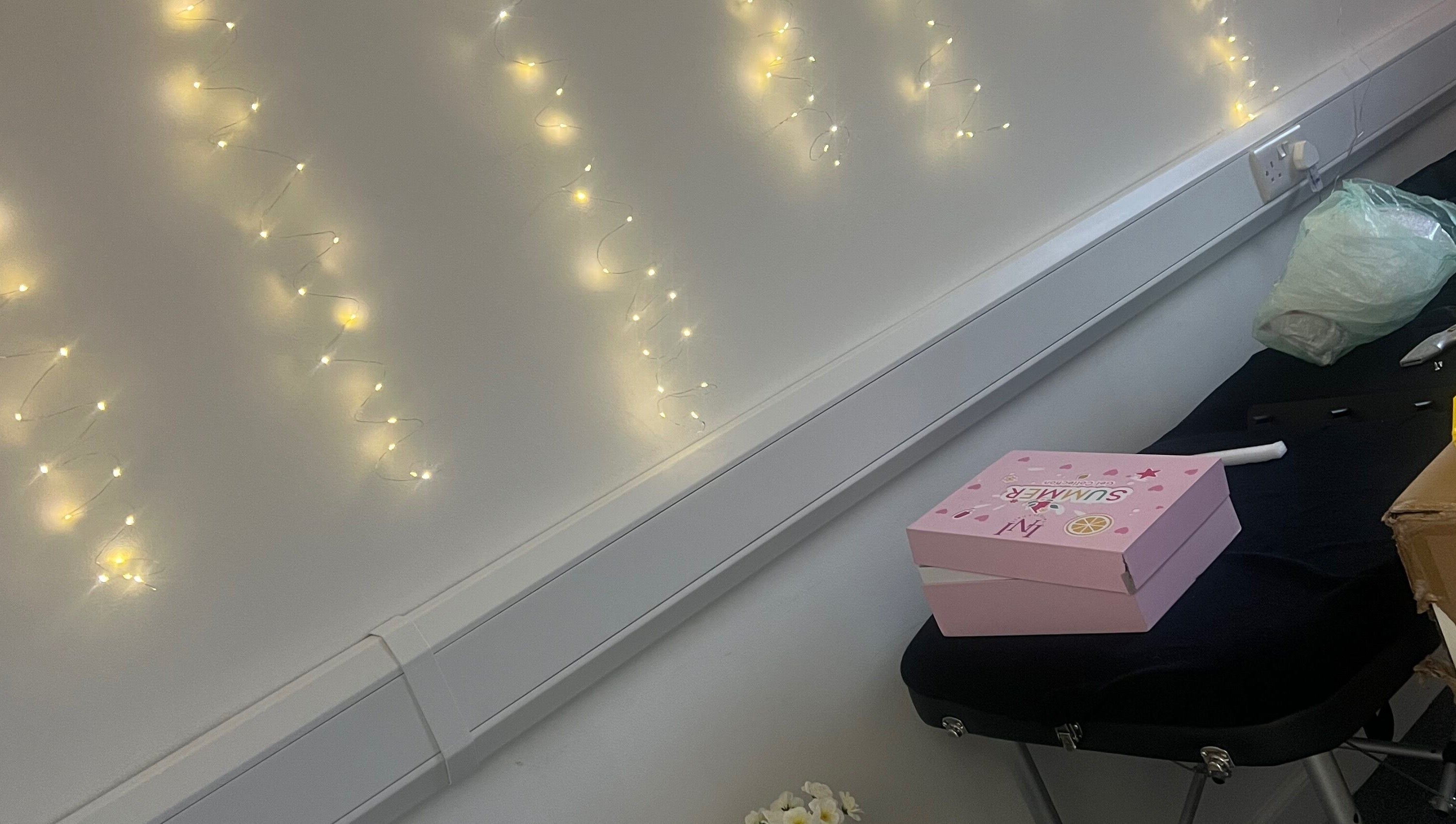 Luna Glow in Edinburgh, Scotland, GB featuring soft fairy lights and a pink box on a massage table.